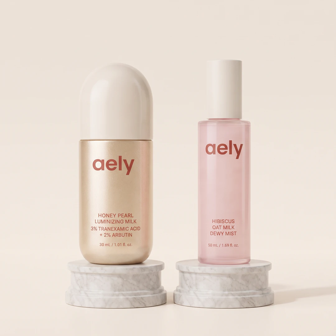 The Dew Duo: the Honey Pearl Luminizing Milk beside the Hibiscus Oat Milk Dewy Mist, both named on the packaging